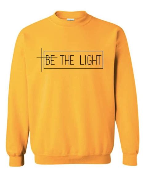 Shine Bright in the Be The Light Sweatshirt – A Must-Have!